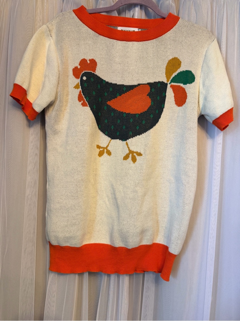 Cream Short-Sleeve Sweater with Orange Trim and Folk Hen Motif